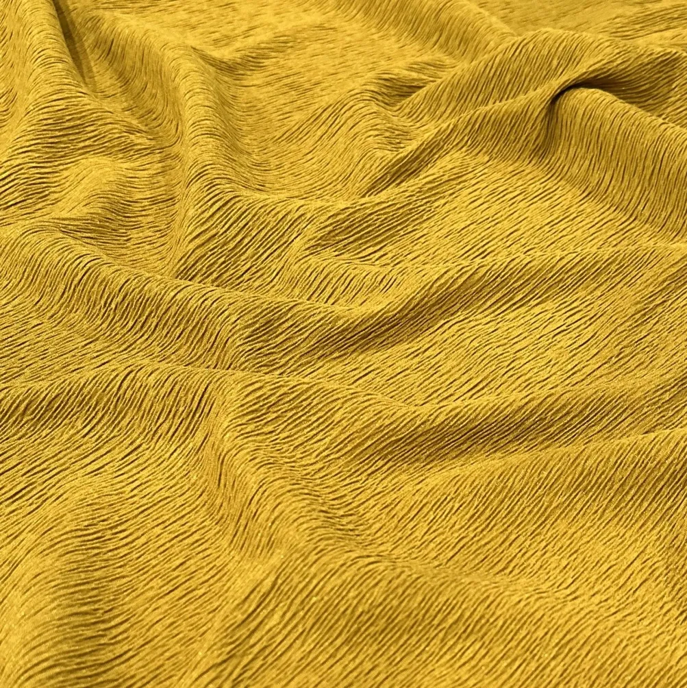 Bella Crepe Table Linen in Gold