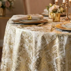 Calypso Jacquard (Reversible) Table Linen in Gold