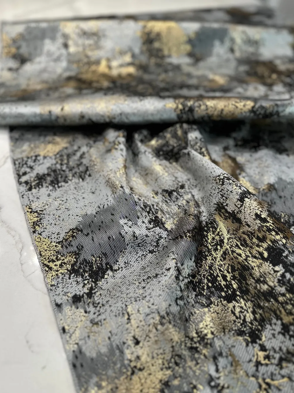 Cascade Jacquard Table Linen in Black and Gold