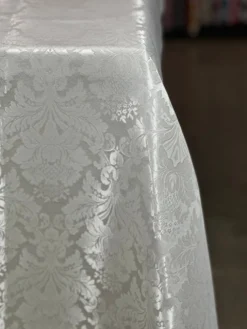 Damask Poly Table Linen in Ivory