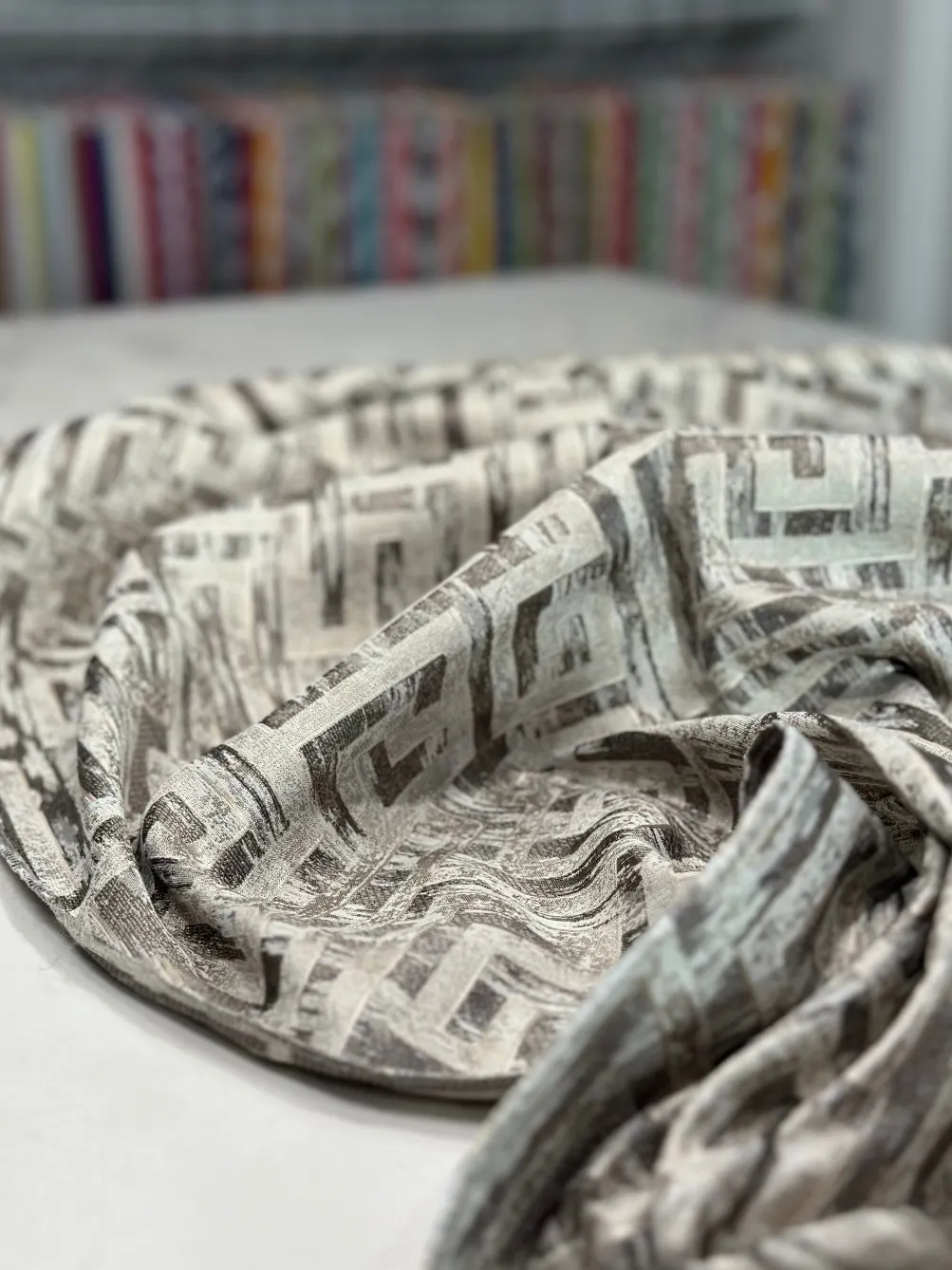Gio Jacquard Table Linen in Taupe