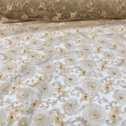 Jasmine Lace Table Linen in Champagne