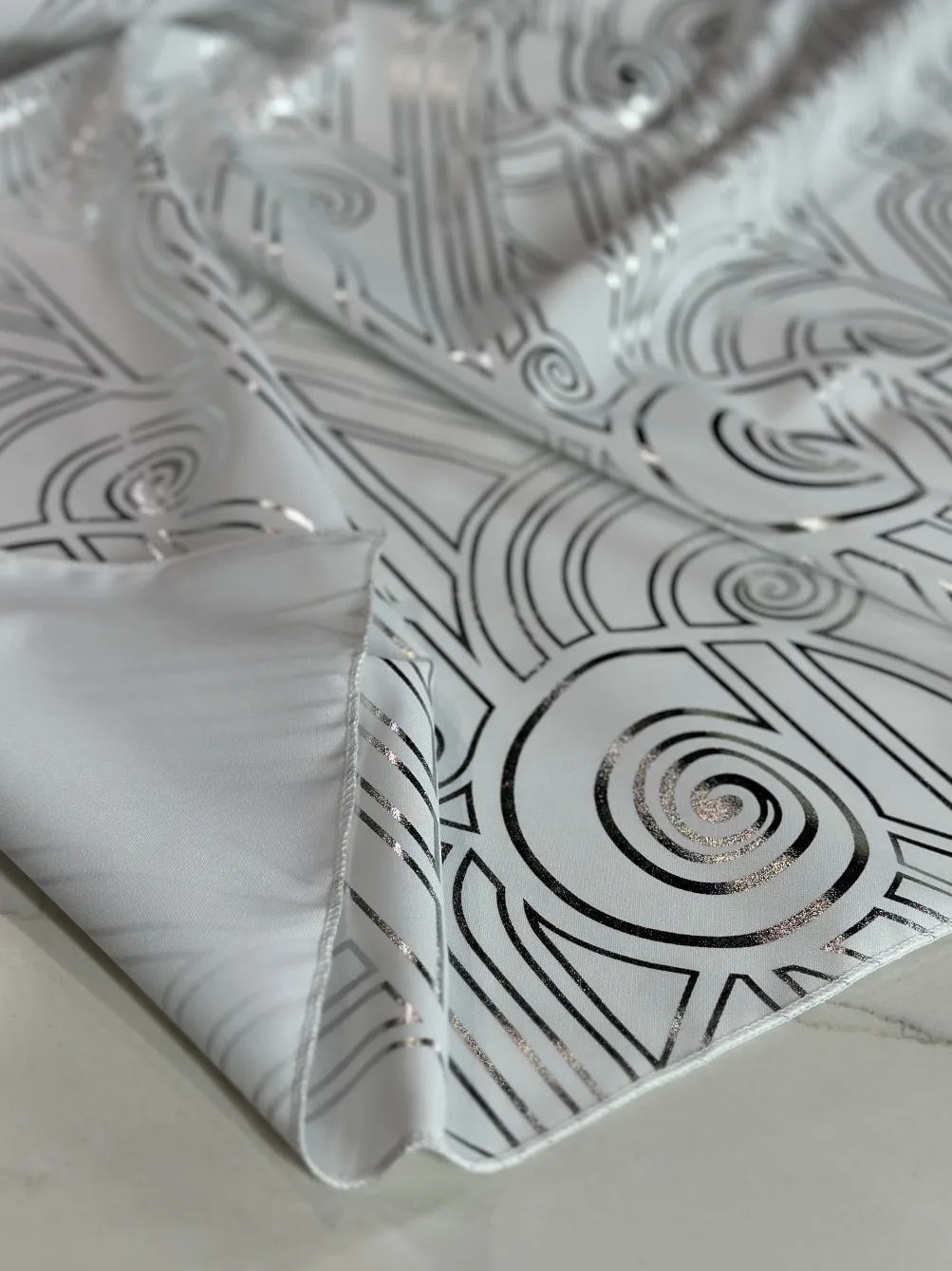 Luxor (Metallic Print) Table Linen in White and Silver