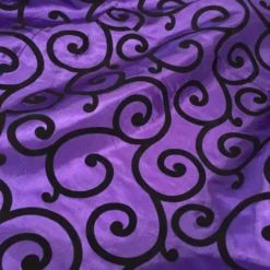 Swirl Flocking Taffeta Table Linen in Black on Purple