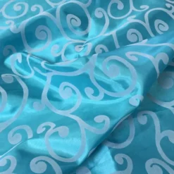 Swirl Flocking Taffeta Table Linen in Silver on Turquoise
